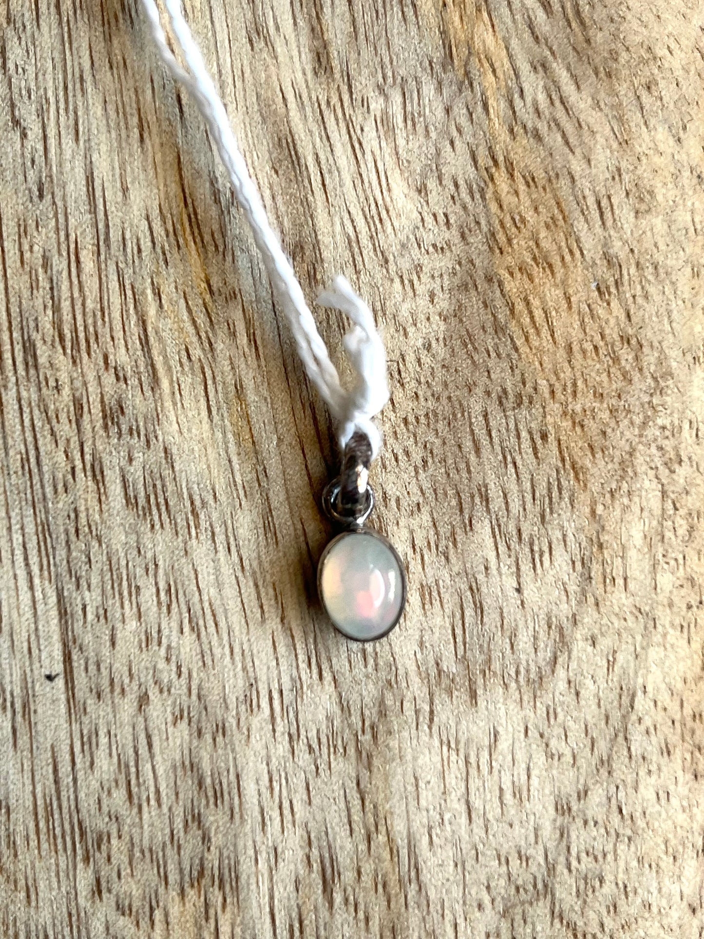 Pendentif Opale serti argent 0.8cm 48eur